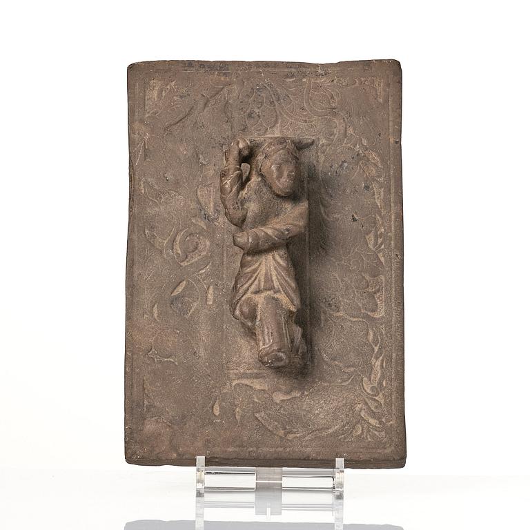 A heavy stone slate/press, presumably Ming dynasty (1368-1644).