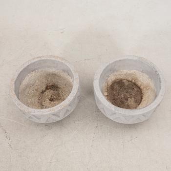 A pair of concrete garden urns later part of the 20th century.