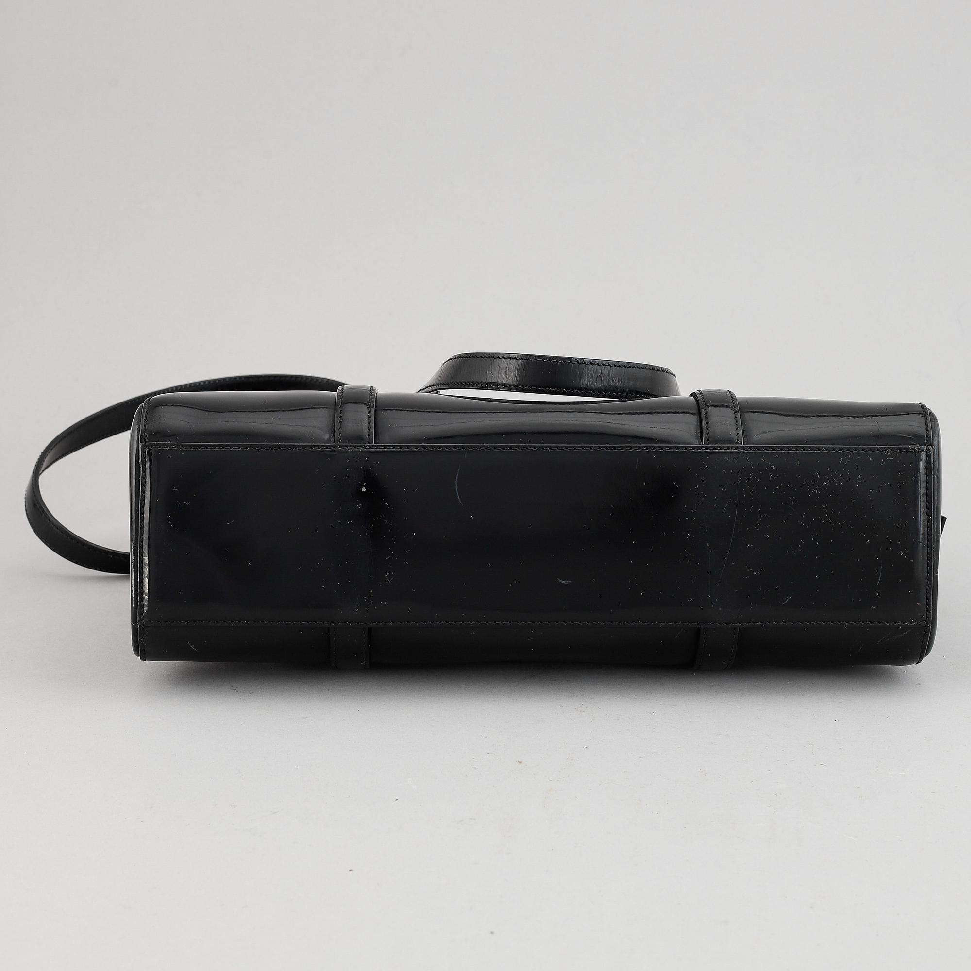 Prada, a patent leather bag.