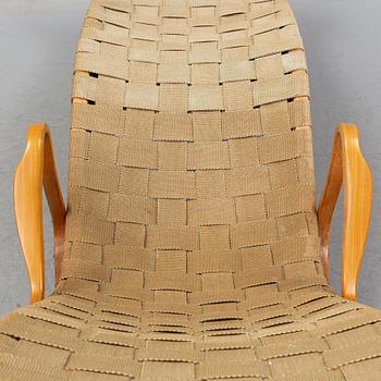 A lounge chair by Bruno Mathsson, mid 20th Century.