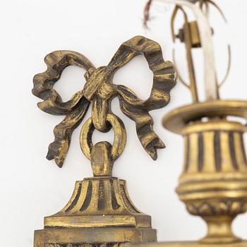 A pair of Louis XVI-style brass appliques, 20th Century.