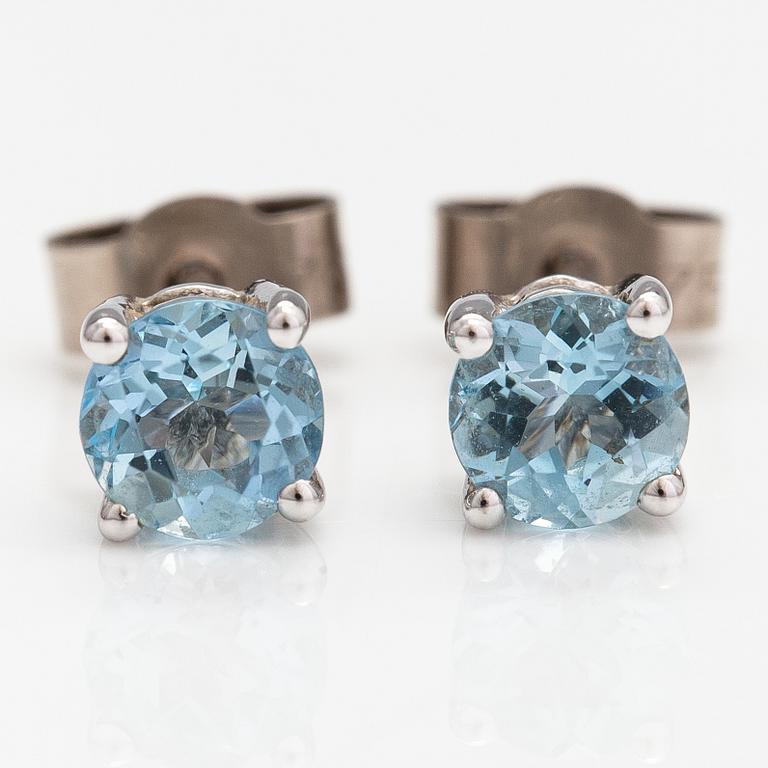 A pair of 18K white gold and aquamarine earrings.