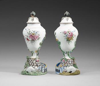 1394. A pair of faience vases with cover, Marieberg, dated 19/3 (17)71.