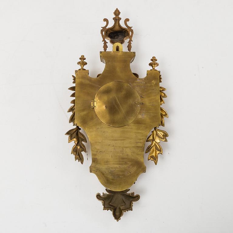 A first half of the 20th century brass wall clock.