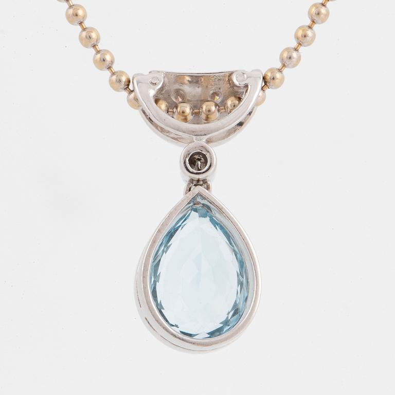 White gold chain and pendant with pearshaped topaz and brilliant-cut diamonds.