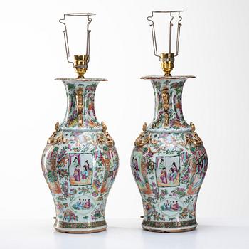 A pair of famille rose Canton vases made in to lamps, Qing dynasty, 19th Century.