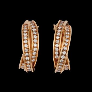 967. A pair of Cartier diamond earrings. Total carat weight circa 1.25 cts. No. 617280.