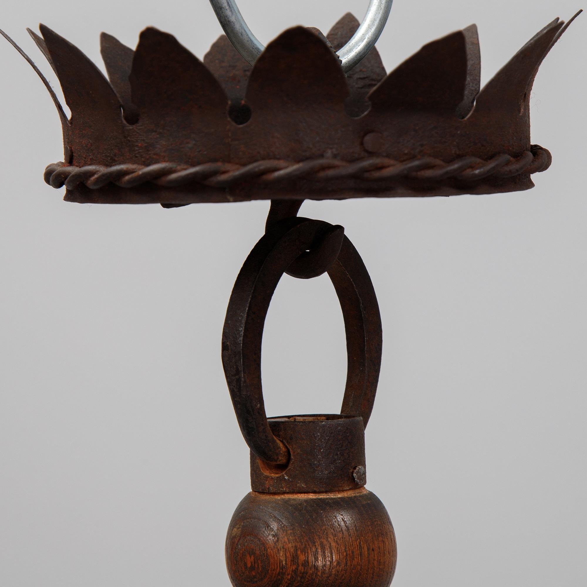 An iron and oak chandelier, 20th Century.