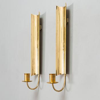 Pierre Forssell, a pair of brass wall lamps "Reflex", Skultuna, Sweden.