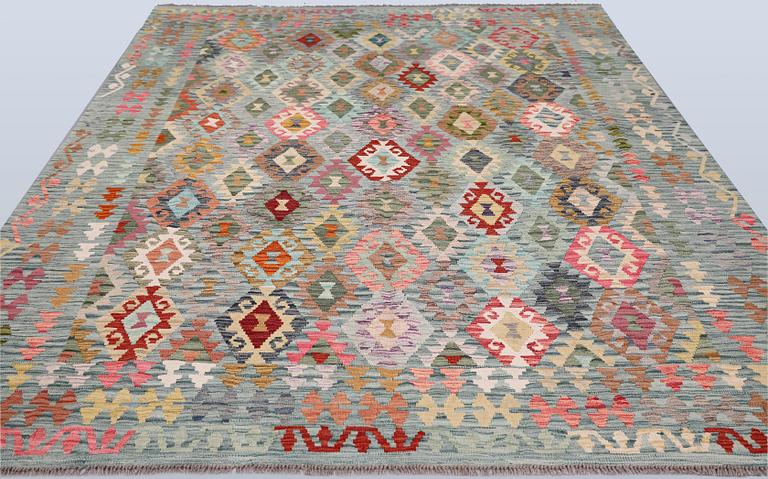 A Kilim rug, approx. 298 x 248 cm.