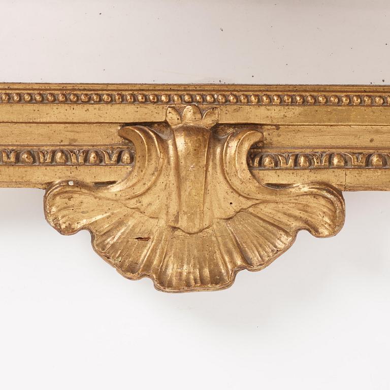 A late-Gustavian carved giltwood mirror by C. Corssar (master in Stockholm 1791-1808).