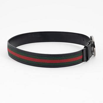 Gucci, a leather and textile belt, size 80.