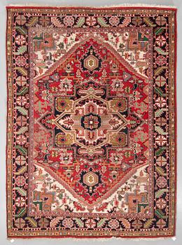 A semi-antique carpet from Eastern Europe, around 335 x 244 cm.