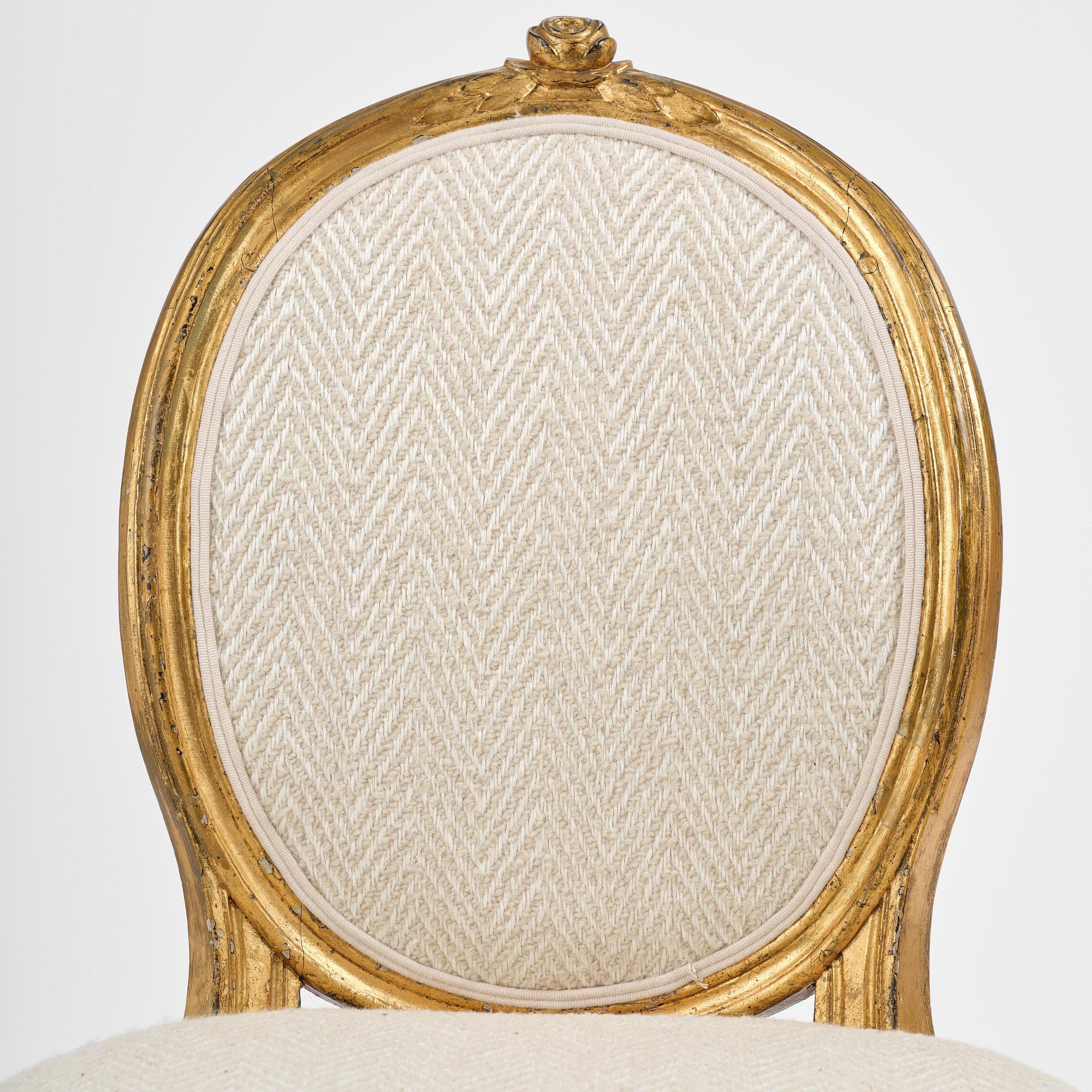 A pair of Gustavian giltwood chairs, Stockholm, late 18th century.