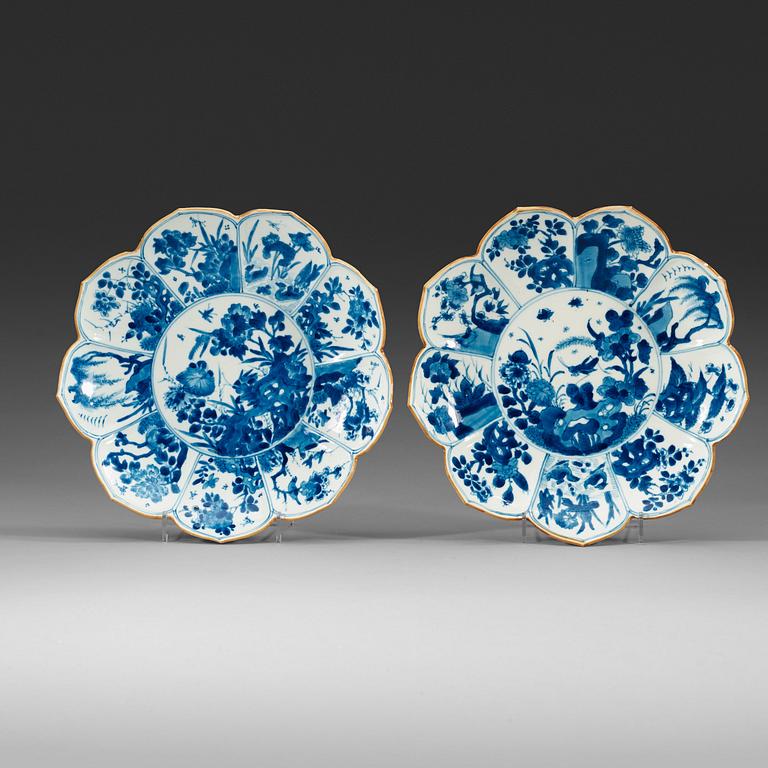 Two blue and white dishes of lotus shape decorated with flowers and insects, Qing dynasty, Kangxi (1662-1722).