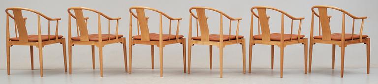 A pair of Hans J Wegner cherry and brown leather 'China chairs', Fritz Hansen, Denmark 1988.