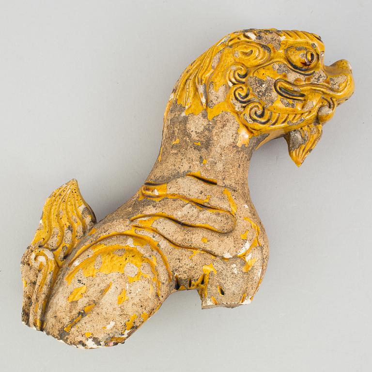 A yellow glazed fragment of a rooftile, Ming dynasty (1368-1644).