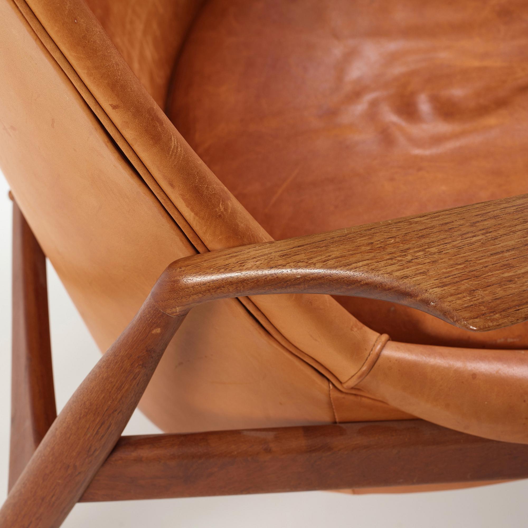 Ib Kofod-Larsen, a "Seal" teak and brown leather armchair, Olof Persson Möbler, Jönköping, Sweden 1950-60's.