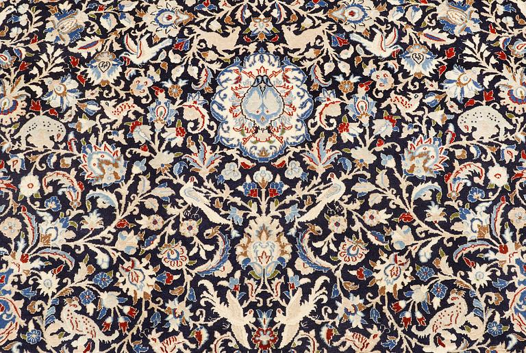A Nain carpet, part silk, so-called 6 LAA, approx. 324 x 210 cm.