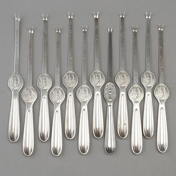 A set of twelve plate lobster forks, mid 20th century.