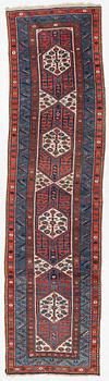 An antique Kurdish runner, probably,. 406 x 105 cm.