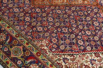 A Tabriz carpet, approximately 360 x 255 cm.