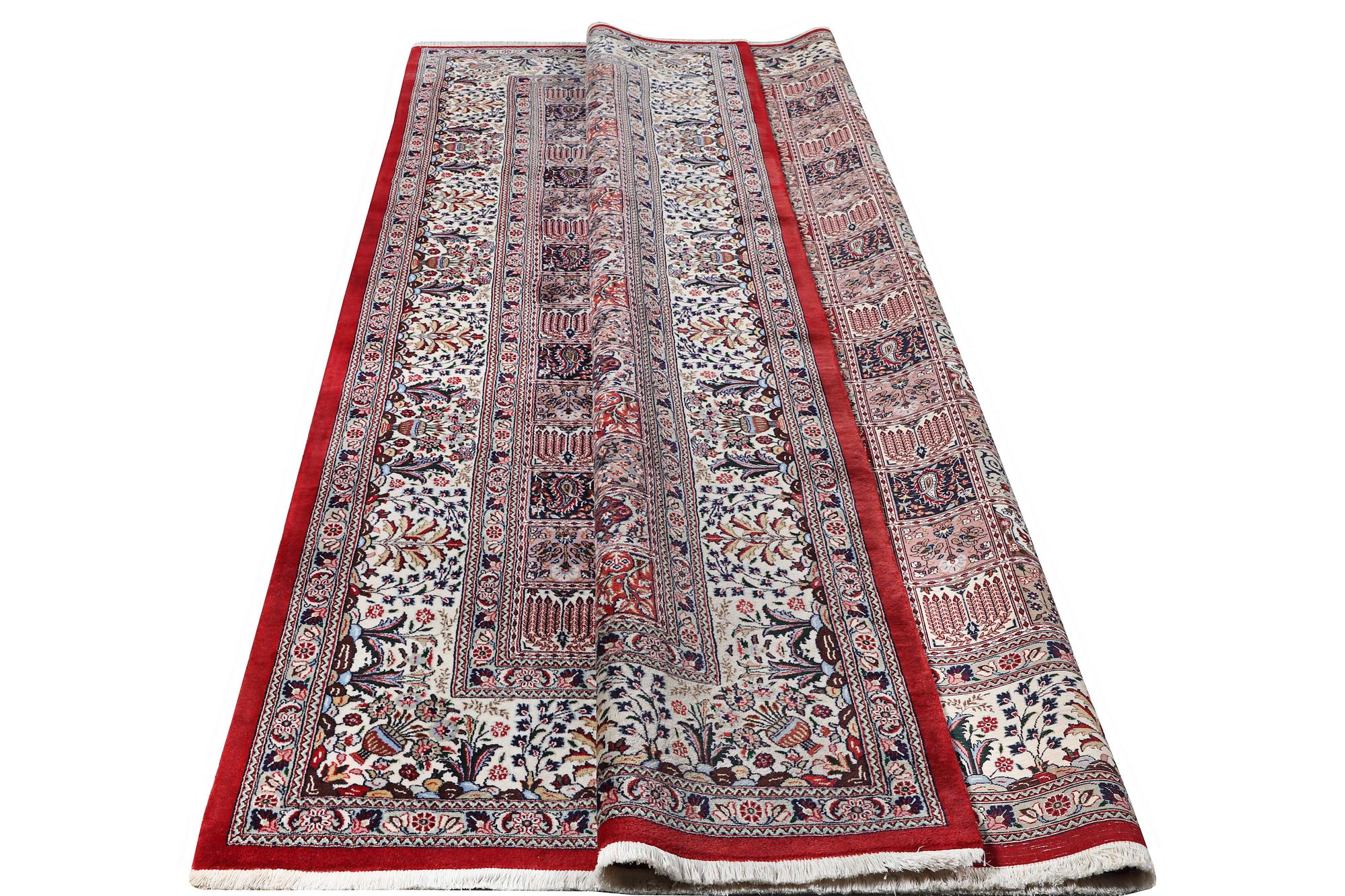 A part silk Ghom carpet, c. 346 x 251 cm.