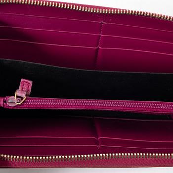 Yves Saint Laurent, a wallet.