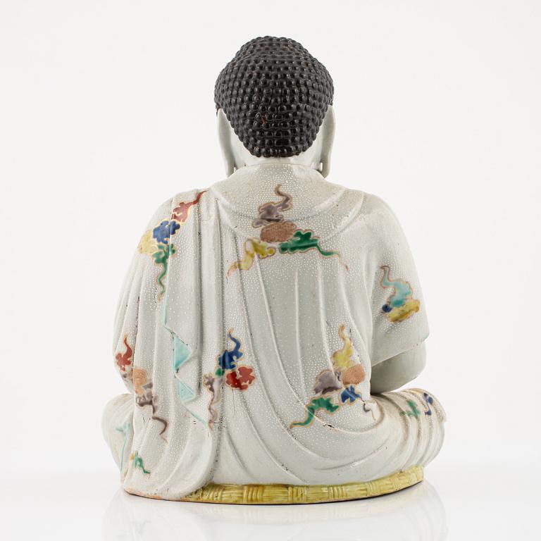 A porcelain buddha, Japan, 20th century.