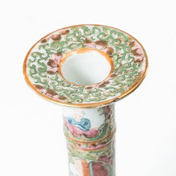 A pair of famille rose Canton candle sticks, Qing dynasty, 19th century.