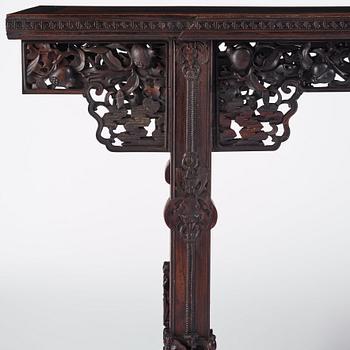 A massive zitan recessed-leg long table 'Jiaotousun Qiotouan', Qing dynasty, 19th century.
