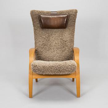 A 'Delta Adventure' armchair with ottoman, Brunstad, Norway.