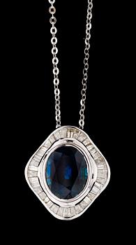 650. A gold diamond and blue sapphire pendant.