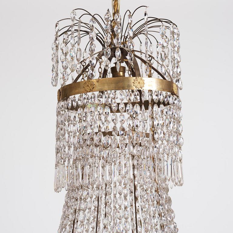 An Empire nine-light gilt-brass and cut-glass, Stockholm, early 19th century.