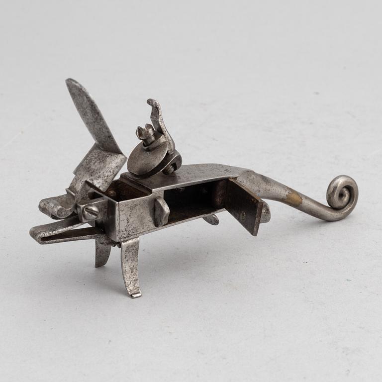 An 18th Century flintlock tinder lighter.