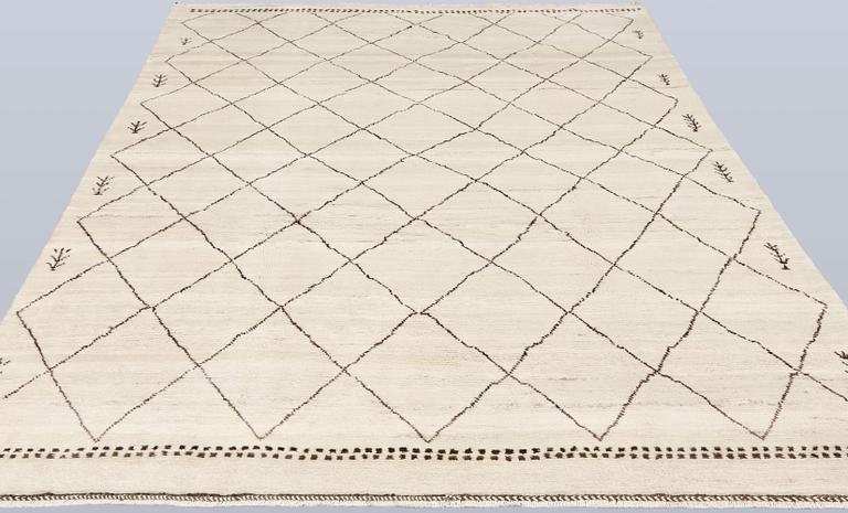 A Moroccan rug, c. 290 x 197 cm.