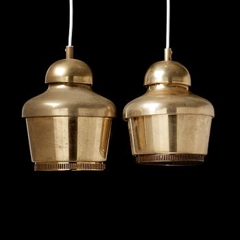 A pair of Alvar Aalto 'A330' brass pendant lamps, Valaistustyö, Finland.