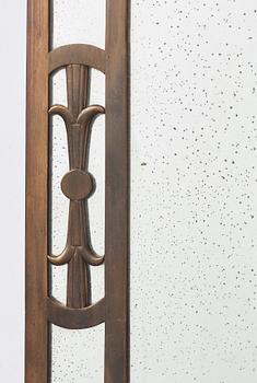 Swedish Grace, a brass framed wall mirror, 1920-30s.