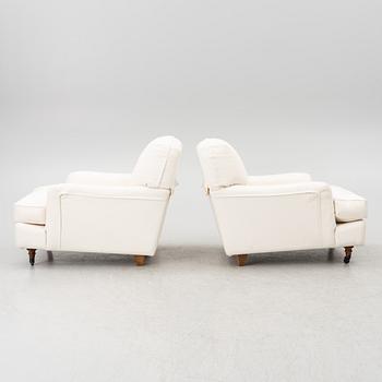 Vico Magistretti, a pair of 'Raffles' armchairs, De Padova, Italy, 21st century.