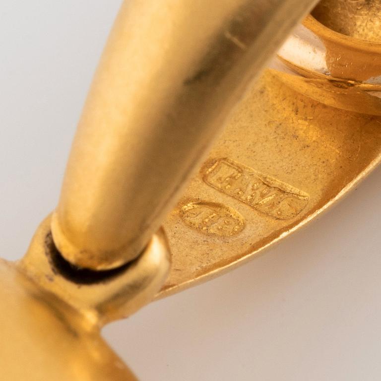 A gold locket with chain.