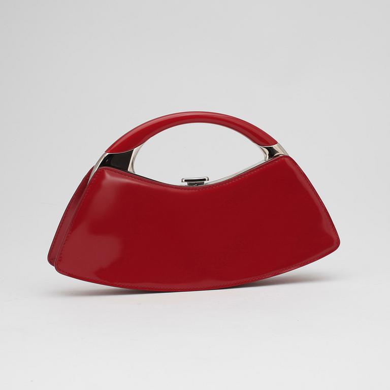 CHRISTIAN DIOR, a red patent leather handbag.