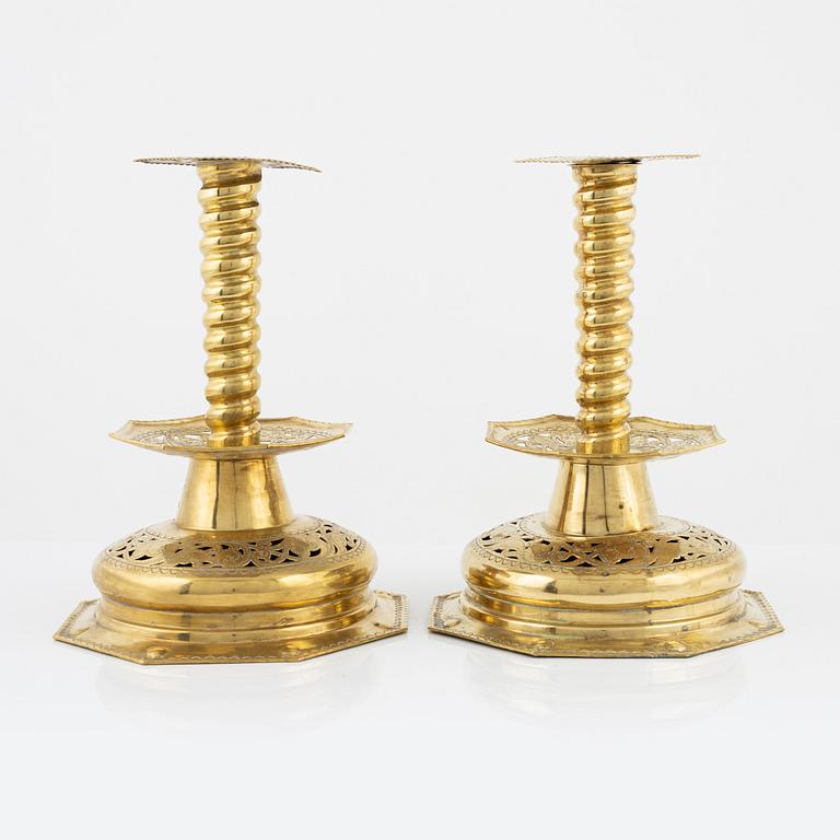 A pair of 19th century Baroque style brass candel sticks.