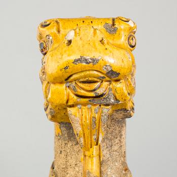 A yellow glazed fragment of a rooftile, Ming dynasty (1368-1644).