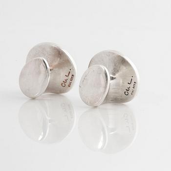 A pair of cufflink, by Ole Lynggaard.