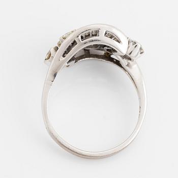 Platinum, brilliant and baguette cut diamond ring.