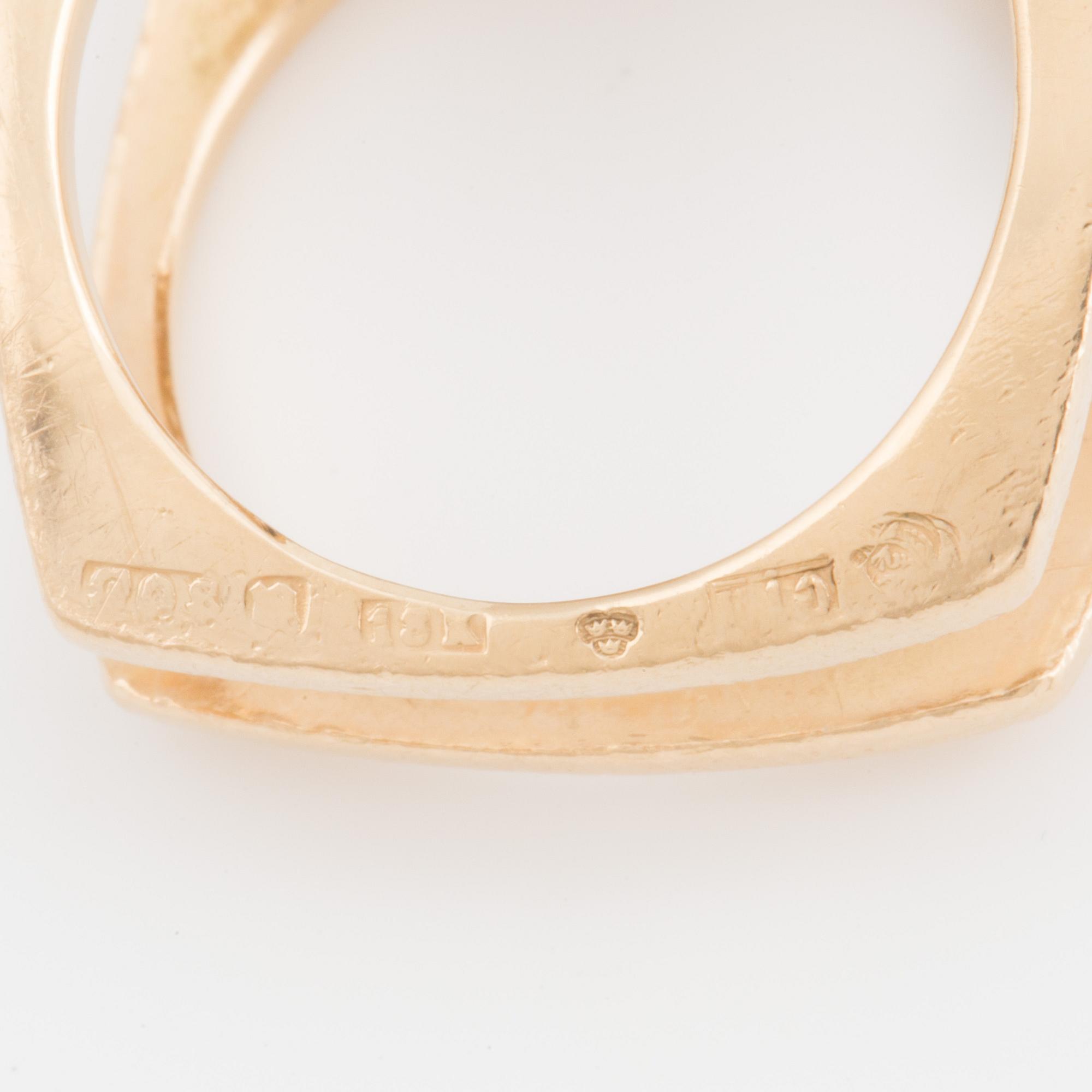 A ring set with four, round, mixed- cut, probably synthetic sapphires.