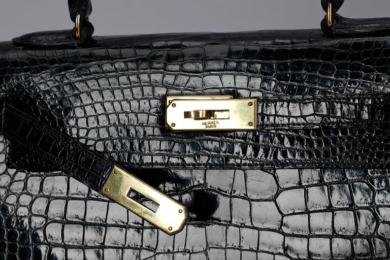 A 1960s/70s black alligator "Kelly" handbag by Hermès.