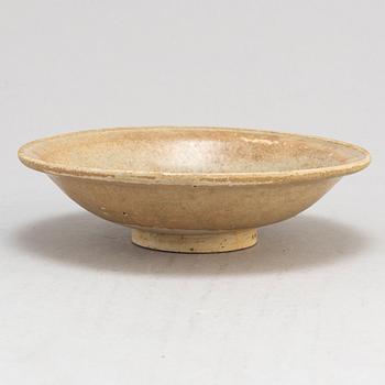 A glazed ceramic dish, presumably Yuan dynasty (1279-1368).