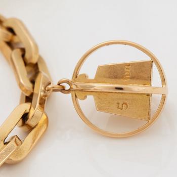 Armband 18K guld med berlocker.