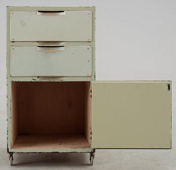 An Alvar Aalto green lacquered plywood bedside locker, Huoneakalu-ja Rakennustyötehdas Oy, Finland 1930's.